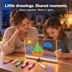 Parent and child drawing together on the LED board