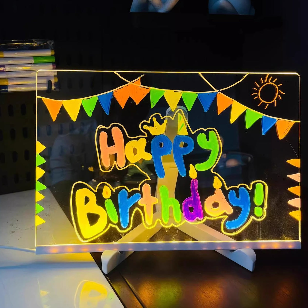 Real photo of the LED drawing board lit up with a Happy Birthday design